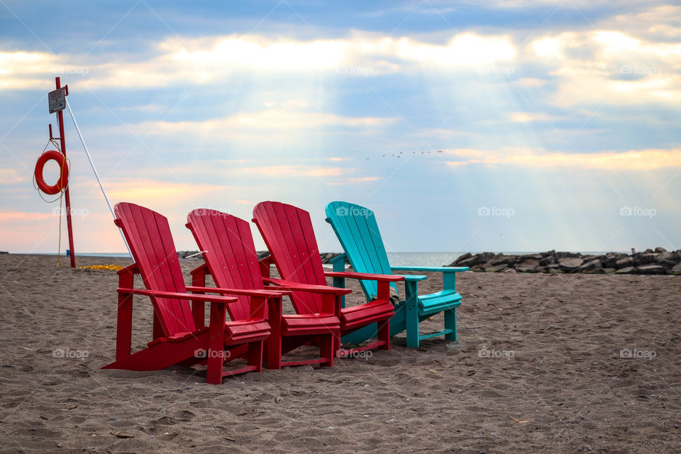 Bright beach chairs on the sand
