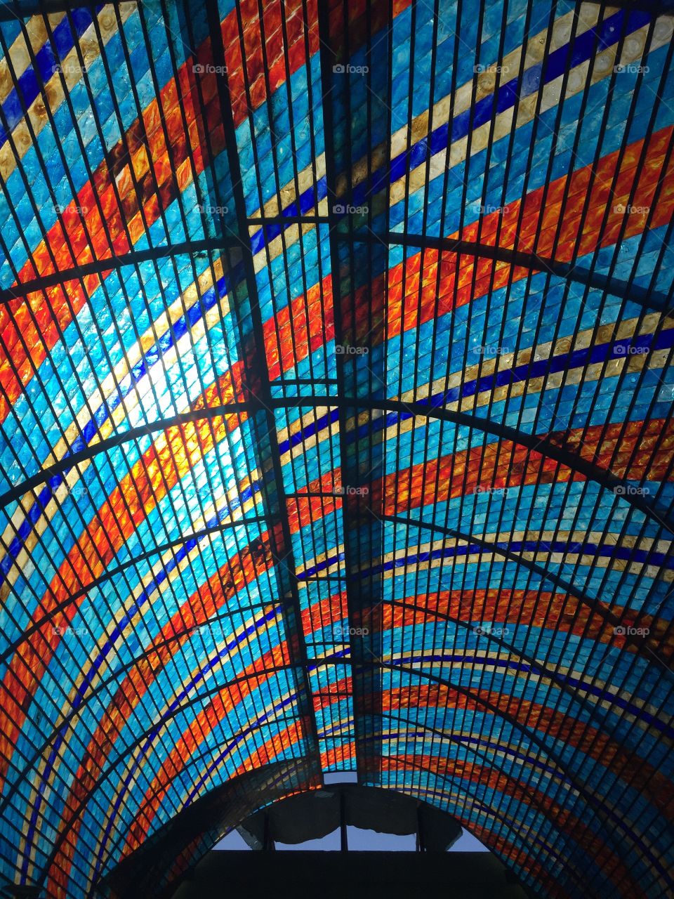 Stunning blue and red glass curved ceiling in a glass shop in Cabo San Lucas in the Mexican Riviera