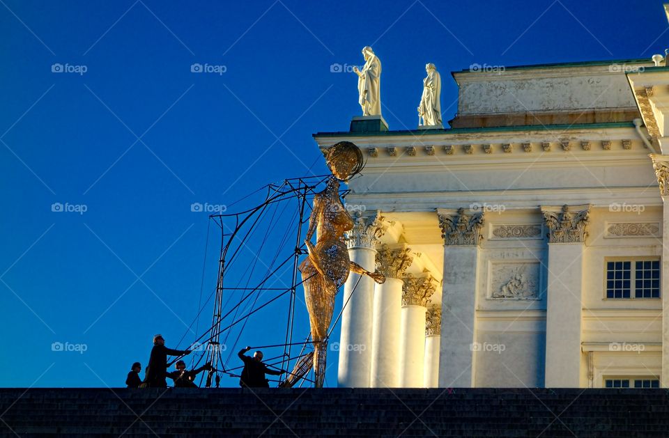 Wooden giant. Giant'by artist group Cie l'Homme debout at the Senate Square in Helsinki, Finland at the Night of the Arts event.