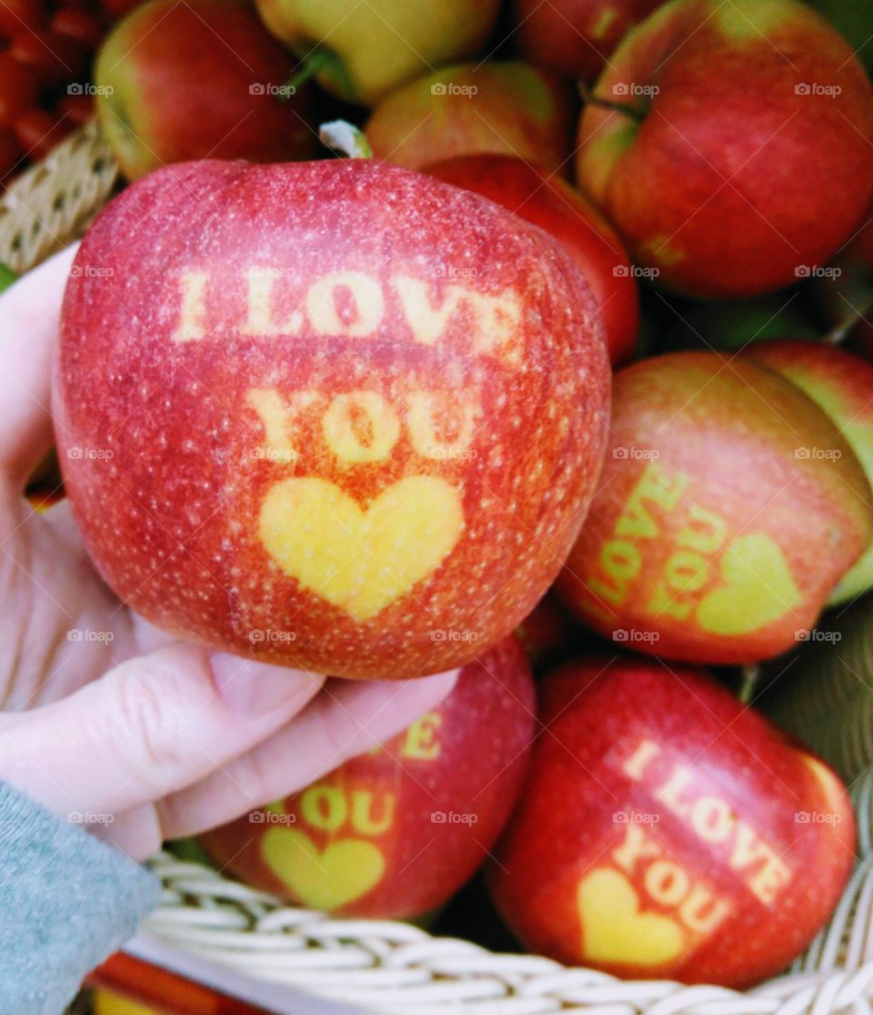 red apple in hand i love you background