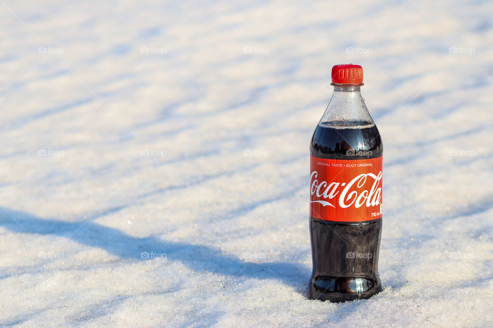 Bottle of a Coca-Cola in the snow