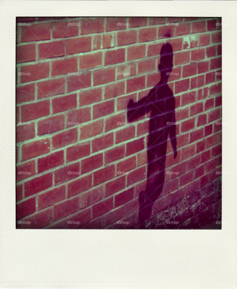 Graffiti Shadow. Shadow of a boy painted on a wall, just one of the interesting bits of graffiti around Nottingham 