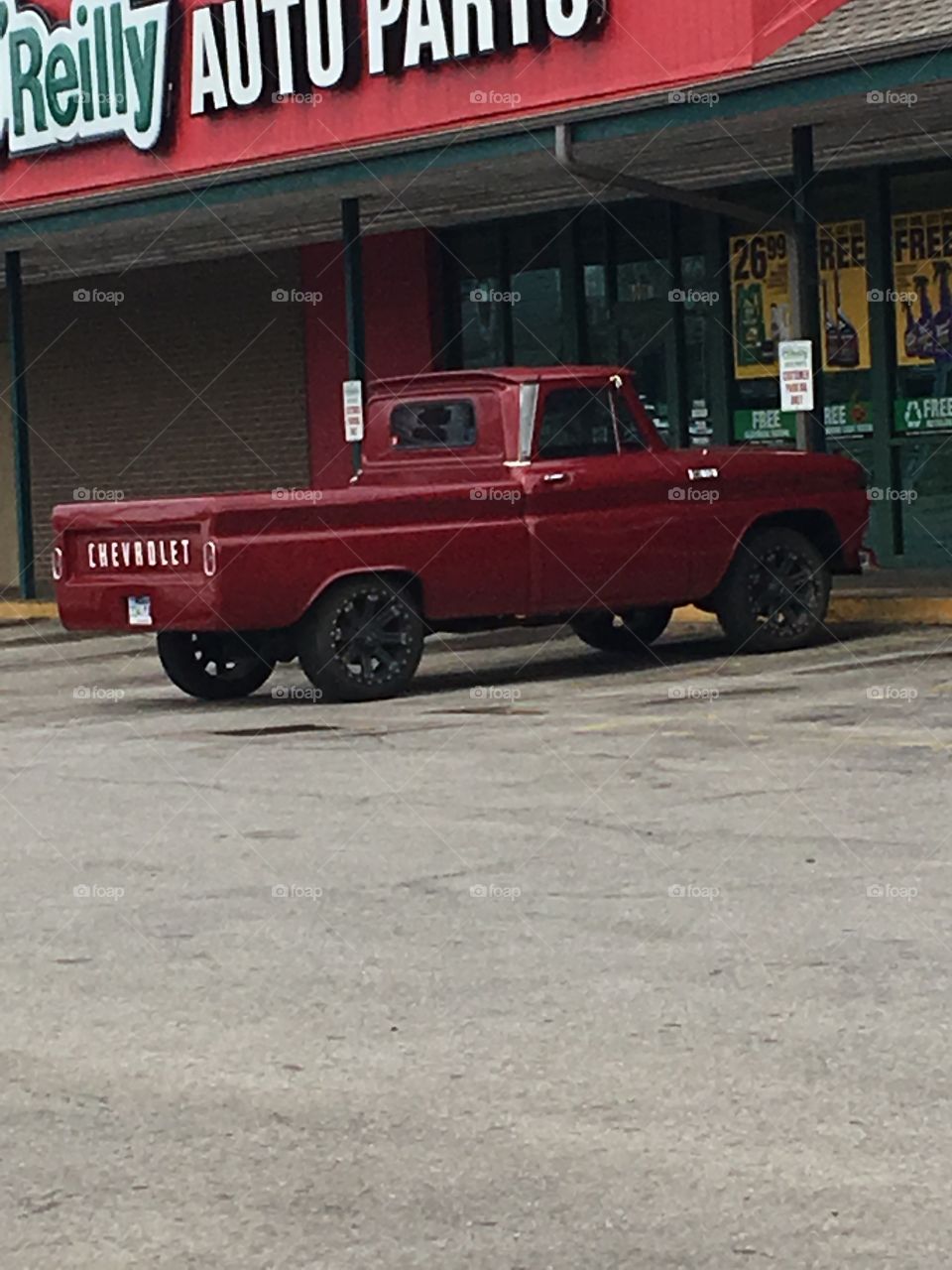 Sweet Sweet Chevy! Maroon in color, customized tailgate with new style wheels at ol Reilly’s auto.