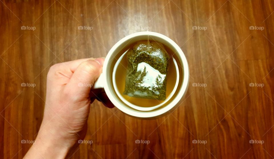 hand holding tea