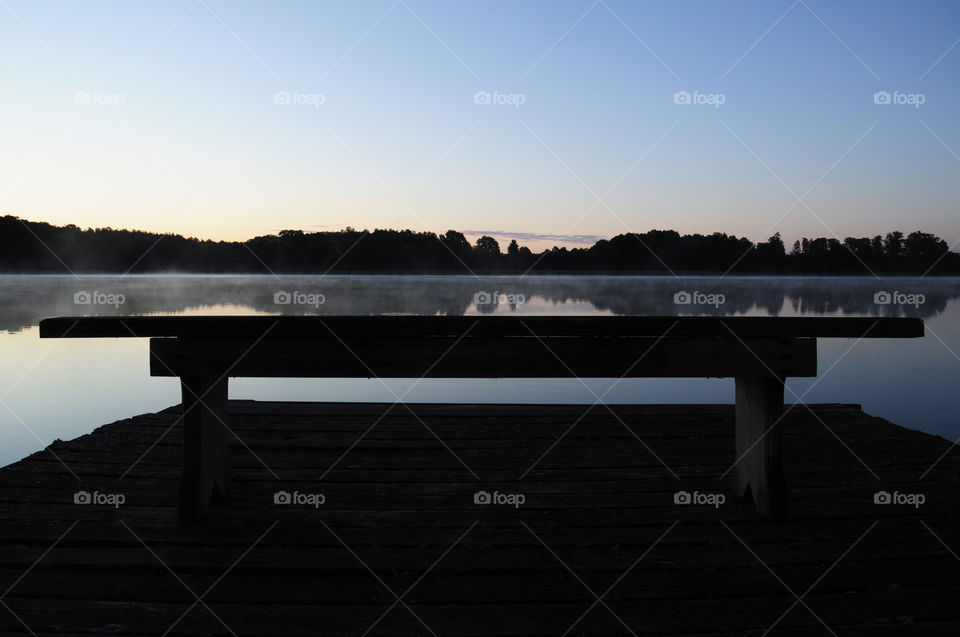 bench silhouette at the lakeside