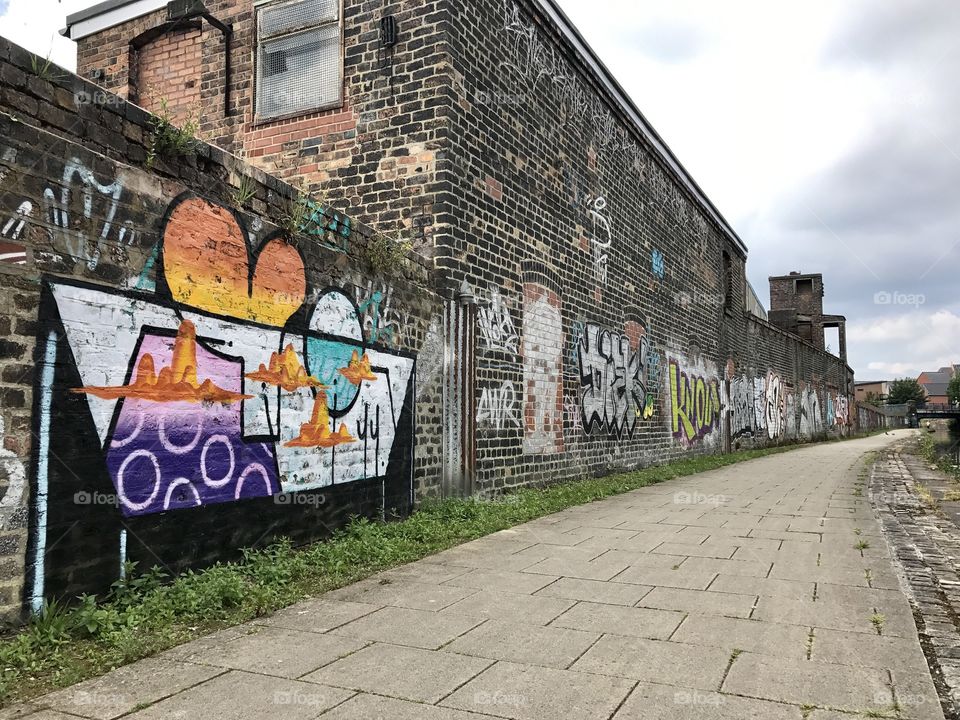 Urban graffiti wall on the Stoke on Trent canal networks. 