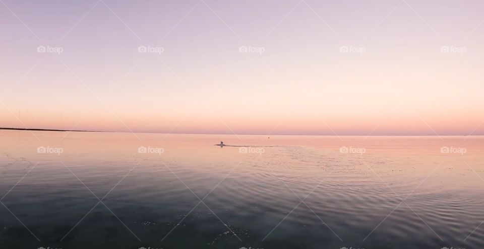 Amazing drone footage of sunset on lake.