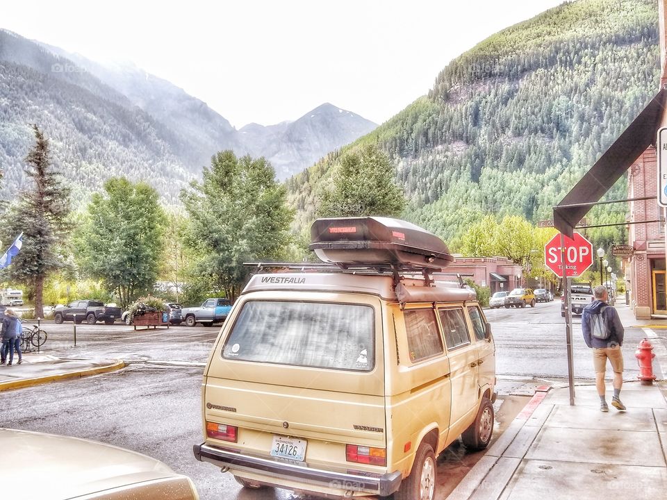 Vintage gold VW bus parked in town of Telluride Colorado. Vibrant HDR image which compels one to dream of the next travel adventure.