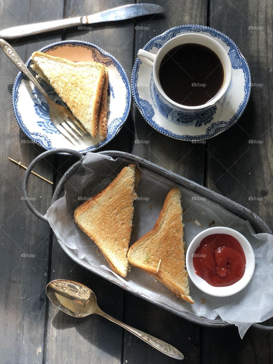 A morning breakfast with potato bread sandwich and coffee.