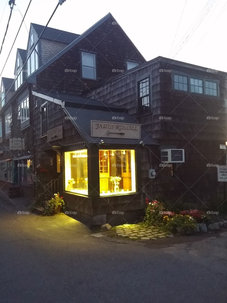 lights on in a shop at dusk. Vacation Rockport