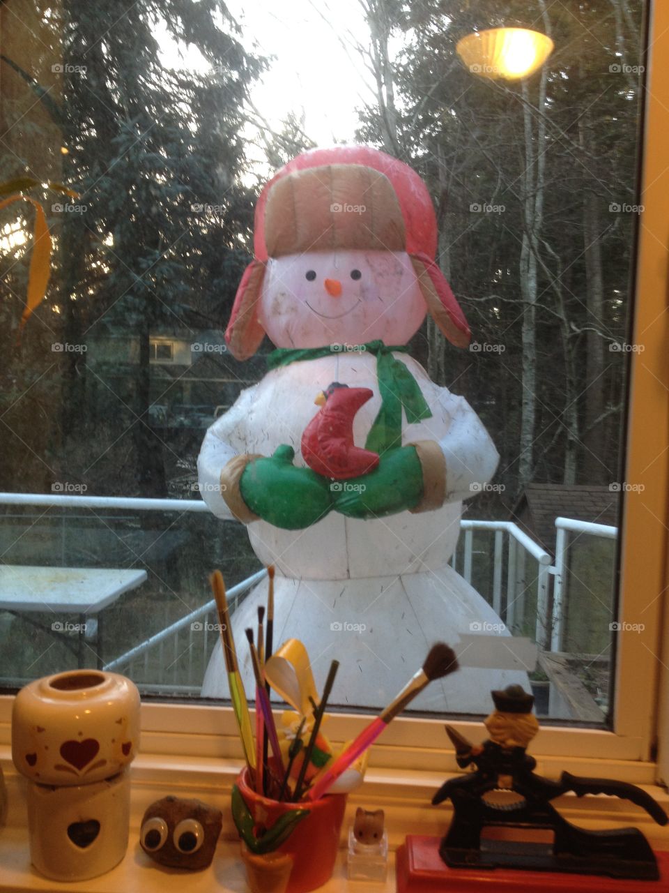 A snowman is peeking in my kitchen window!