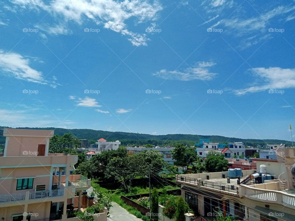 The blue monsoon sky roofing Dehradun, the city of love