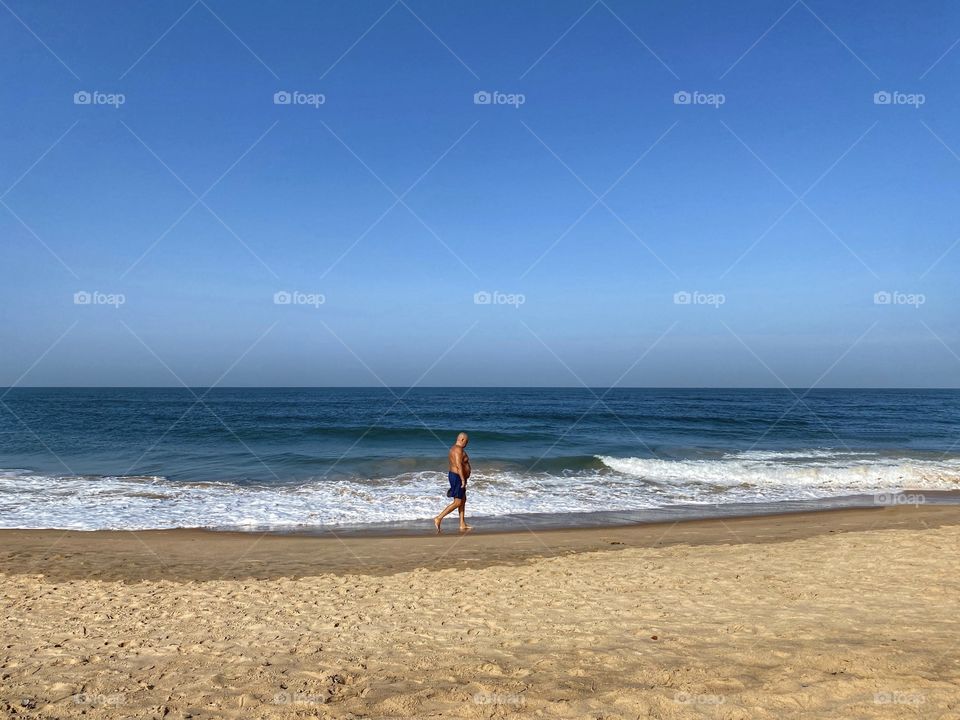 Man walking near beach 