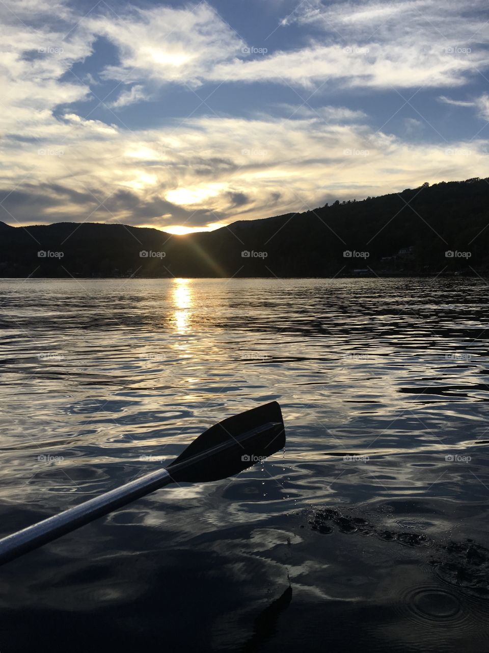 Paddling along the lake at sunset