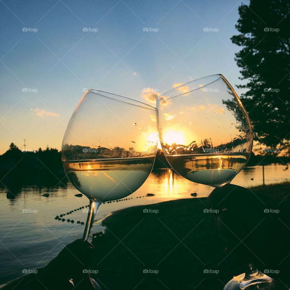 glasses of wine at sunset