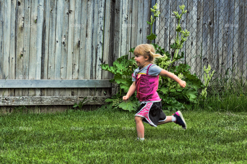 Running Girl 2. Granddaughter playing in back yard