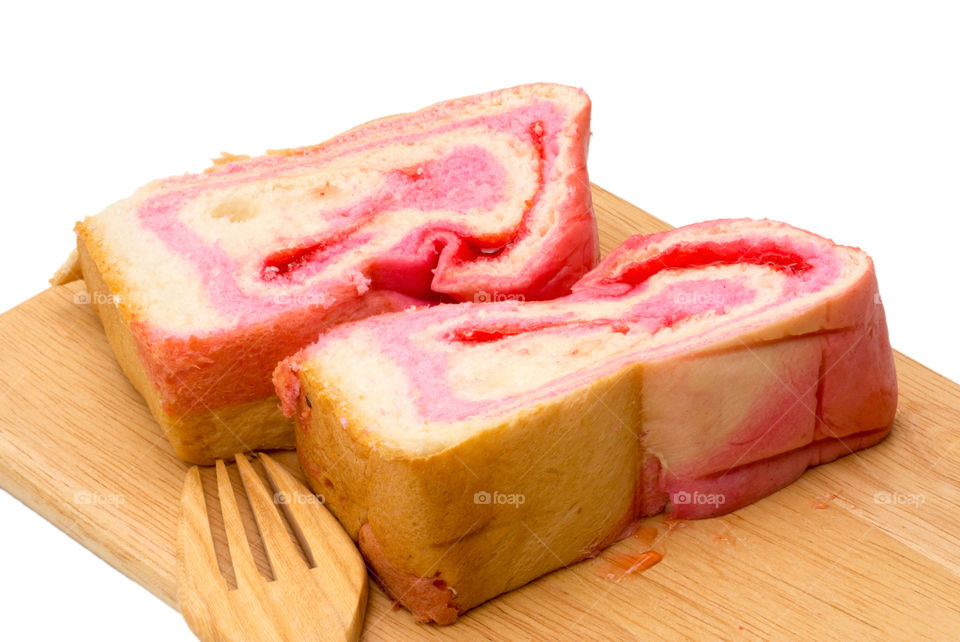 sliced strawberry bread on  board.