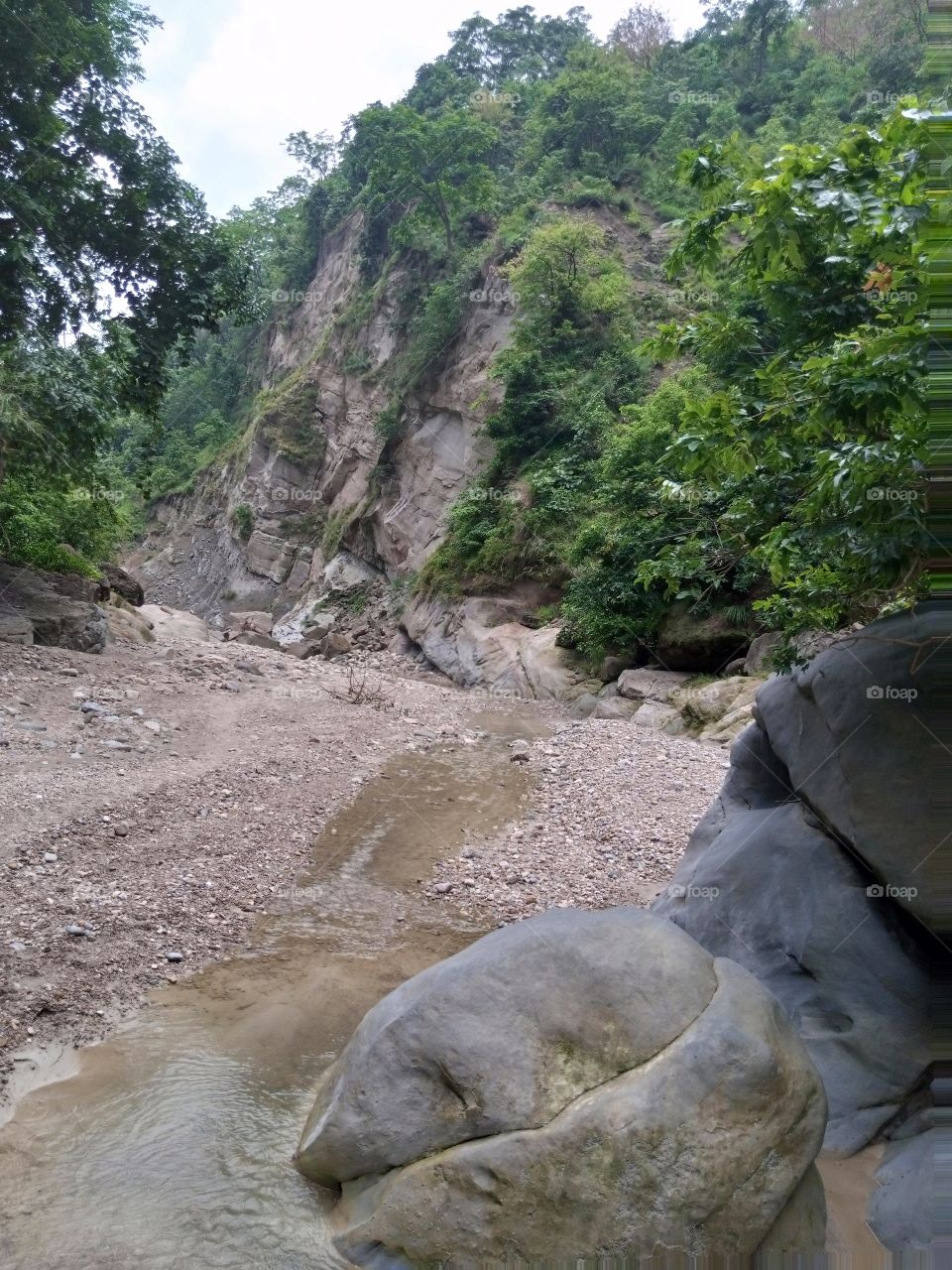 a river in the middle of the mountain