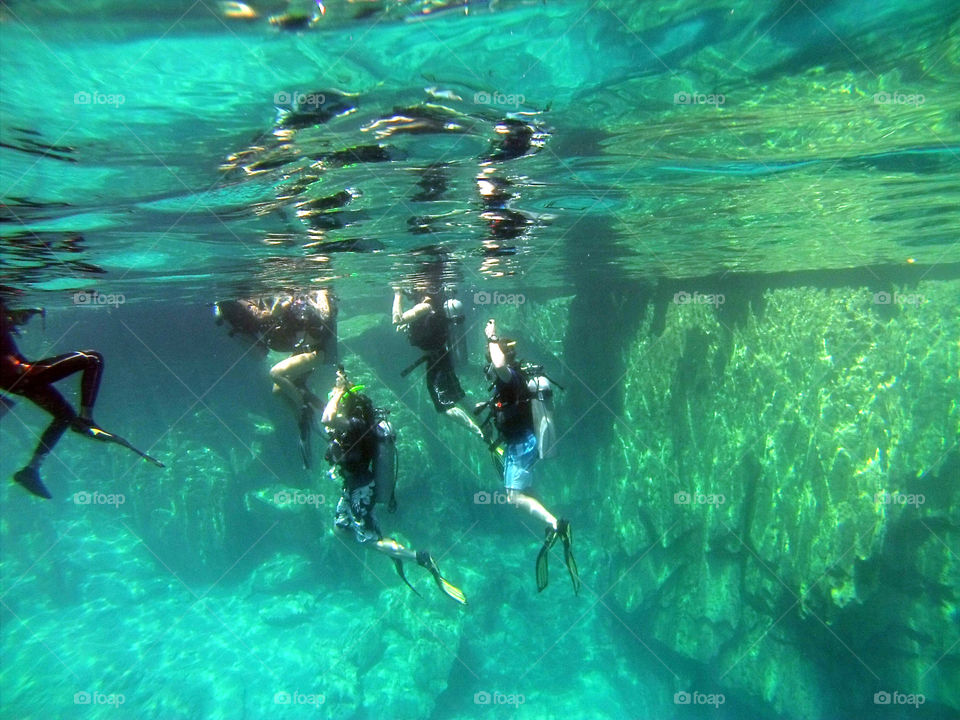 Diving lessons in a lake. Underwater
