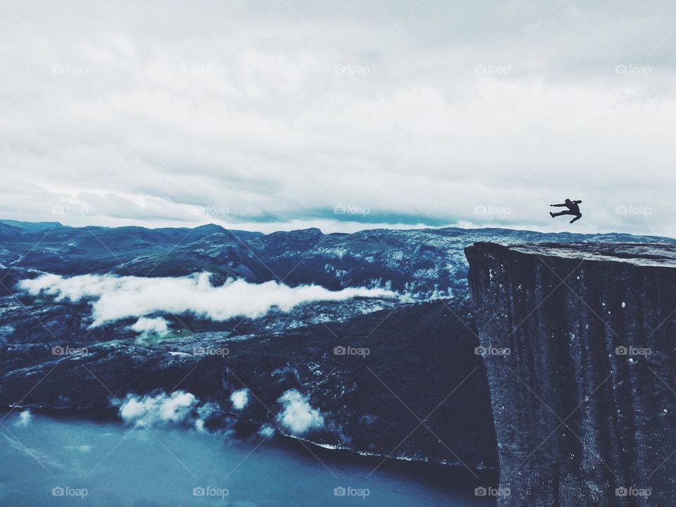 Jump at Prekestolen rock in Norway. 