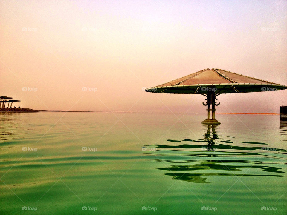 Scenic view of parasol in sea