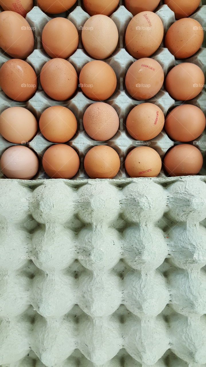 Fresh eggs with one empty tray