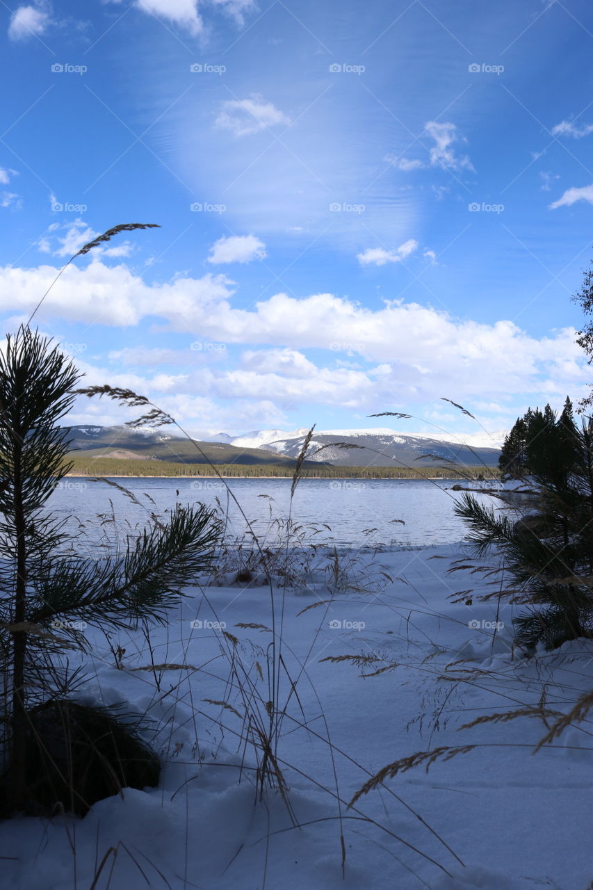 Scenic view across the lake of the mountains.