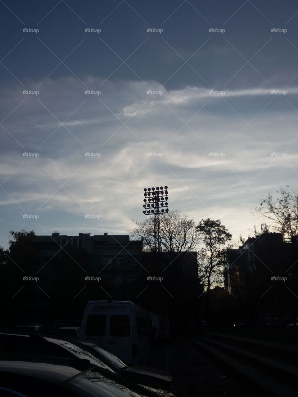 Sunset at sports field in city