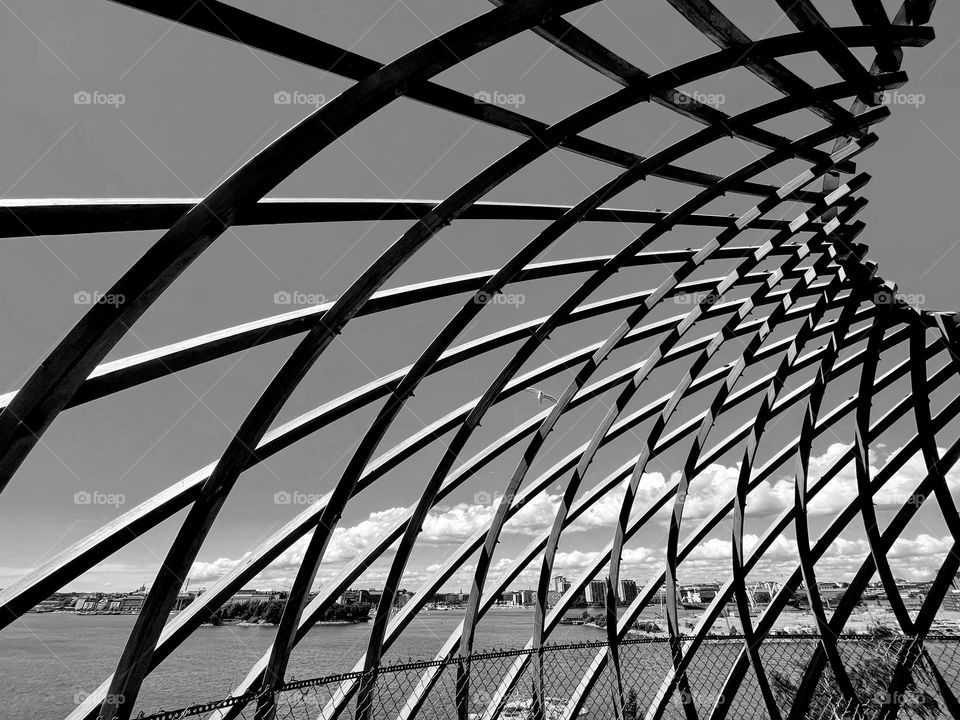 Side angle view to the mesh wooden construction against the sky 