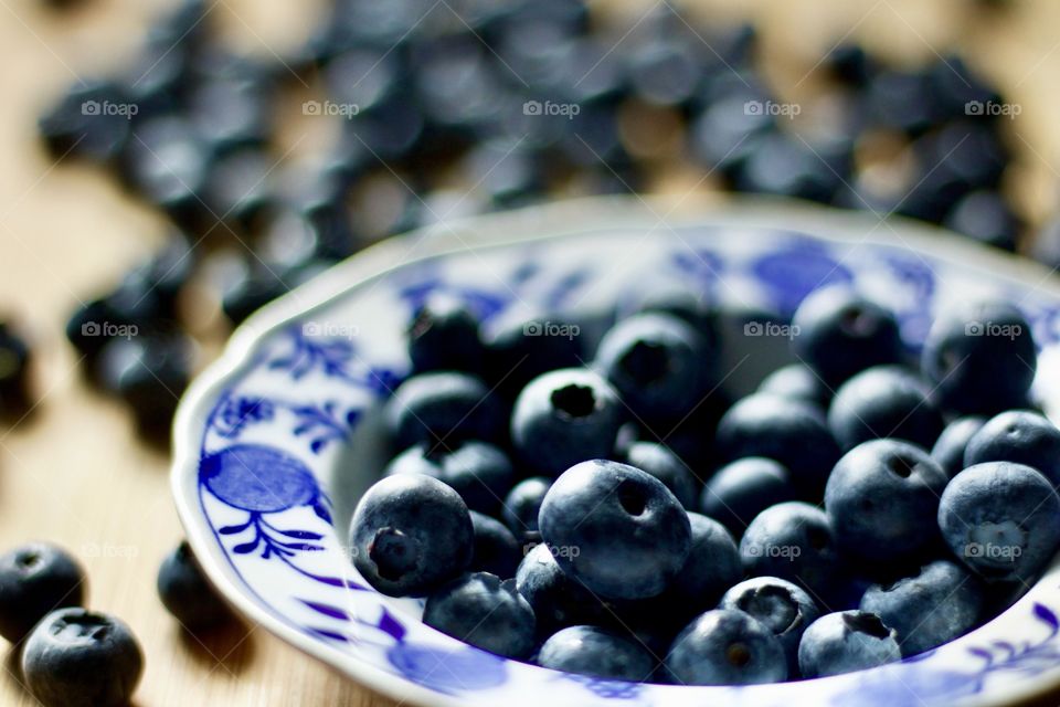 Fruits! - Blueberries in a vintage delft blue bowl on bamboo in natural light