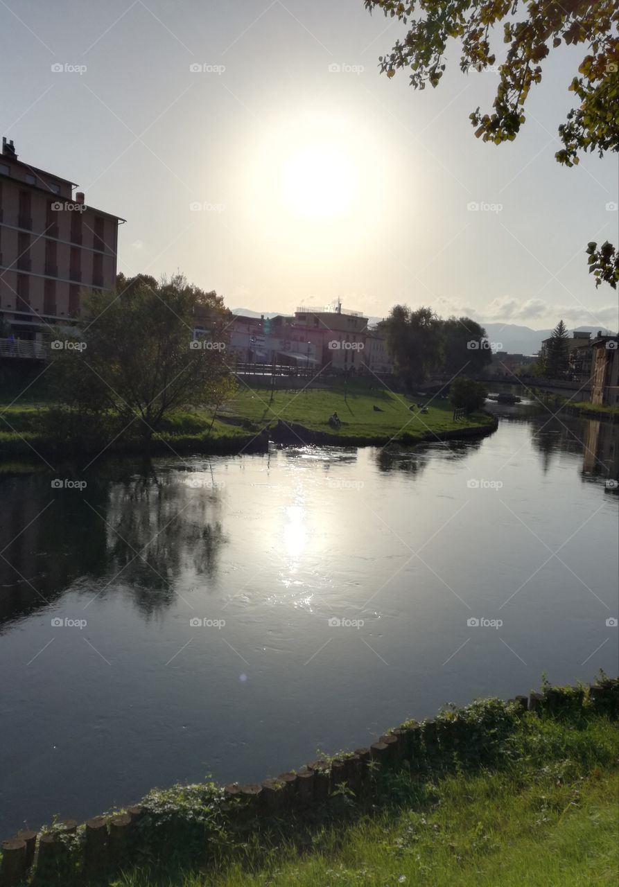 The sun is reflected in the river