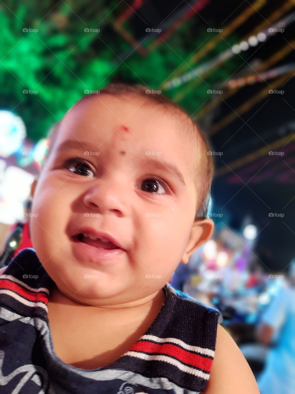 Indian baby give smile.
