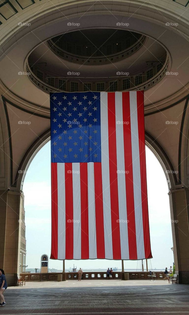 Displaying the flag proudly in the city.