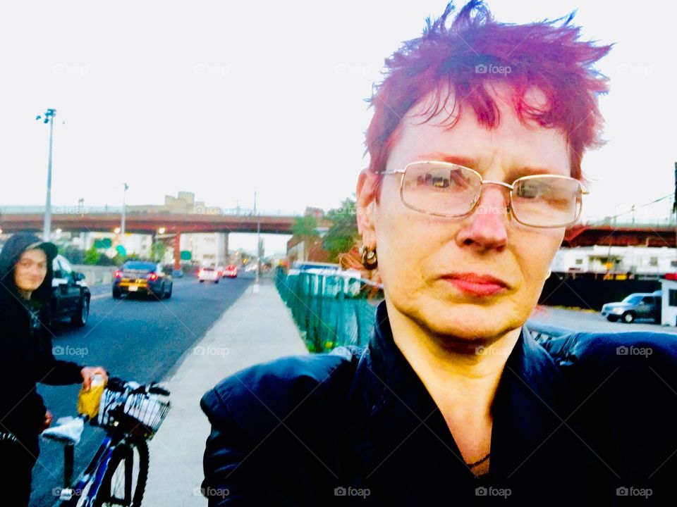 Self portrait standing on Borden Avenue in Long Island City, Queens, New York photographed in the Spring of 2019. Hypnotic Productions