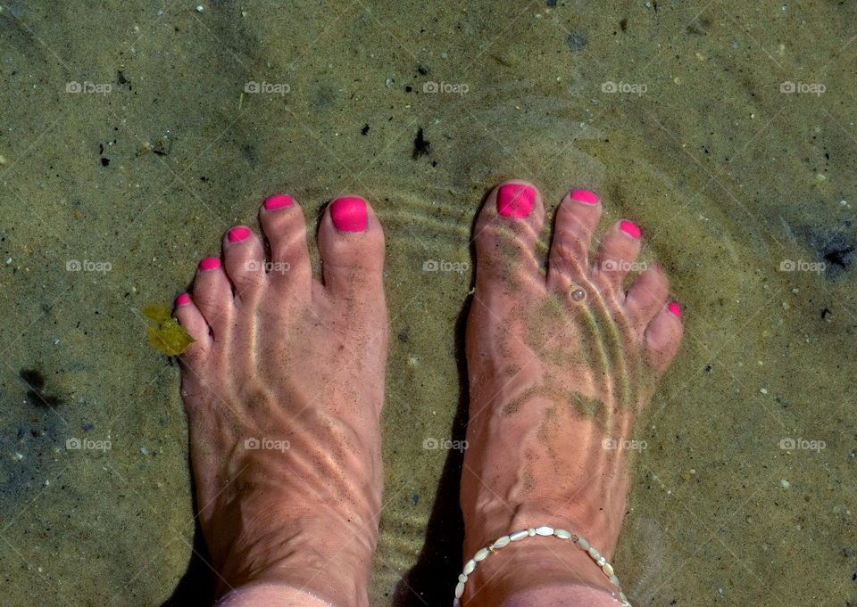 Feet in water with ripple
