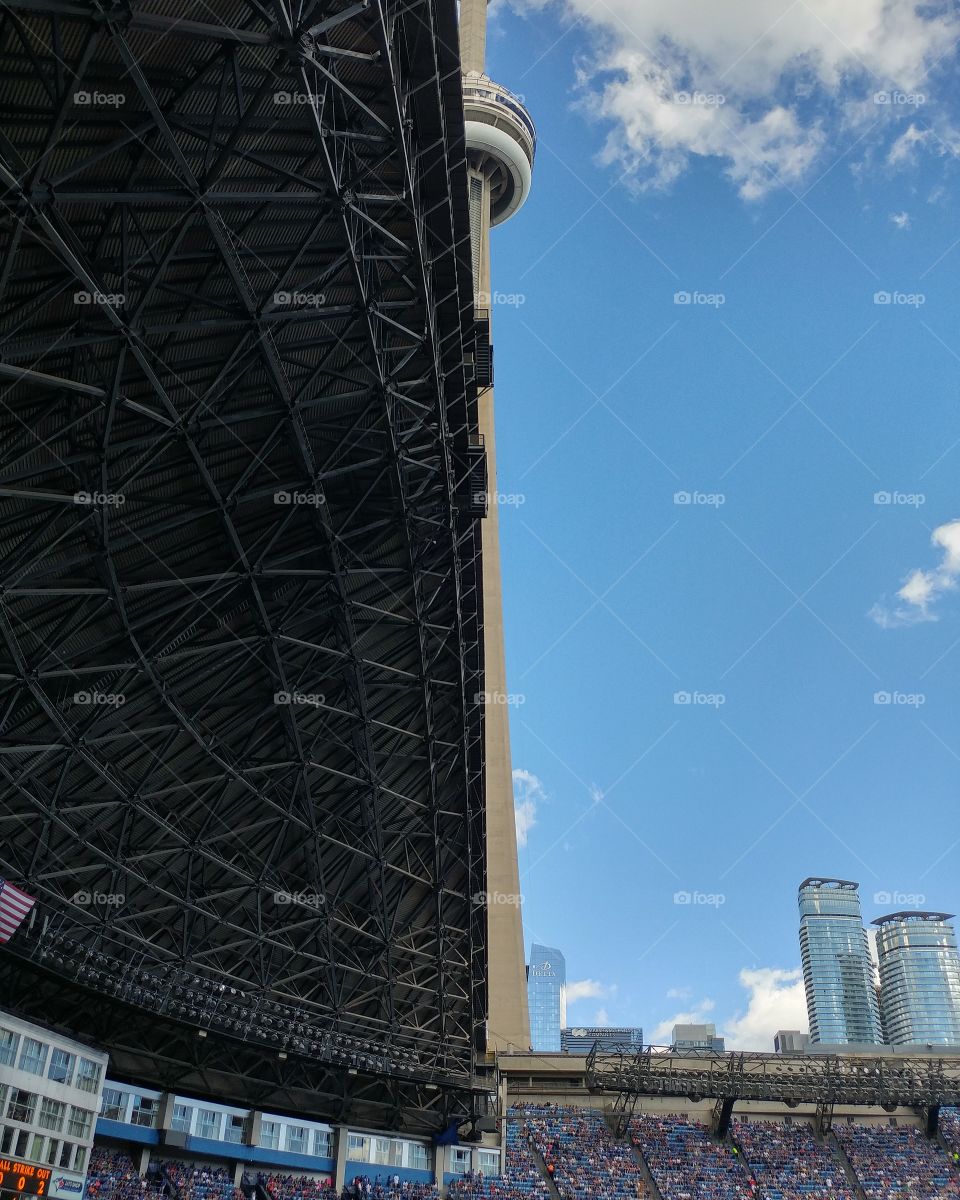 bisection of CN Tower by stadium retractable roof