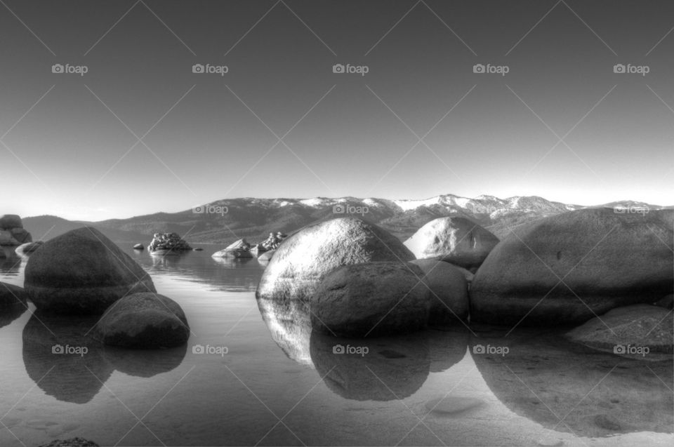 Stones reflecting on sea