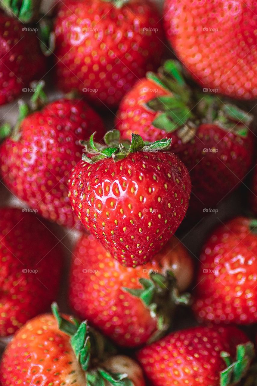 Fresh strawberries in frame.