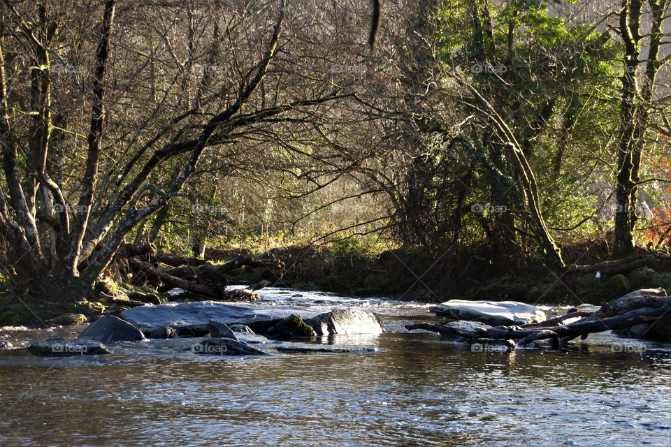 Broken rock bridge on river