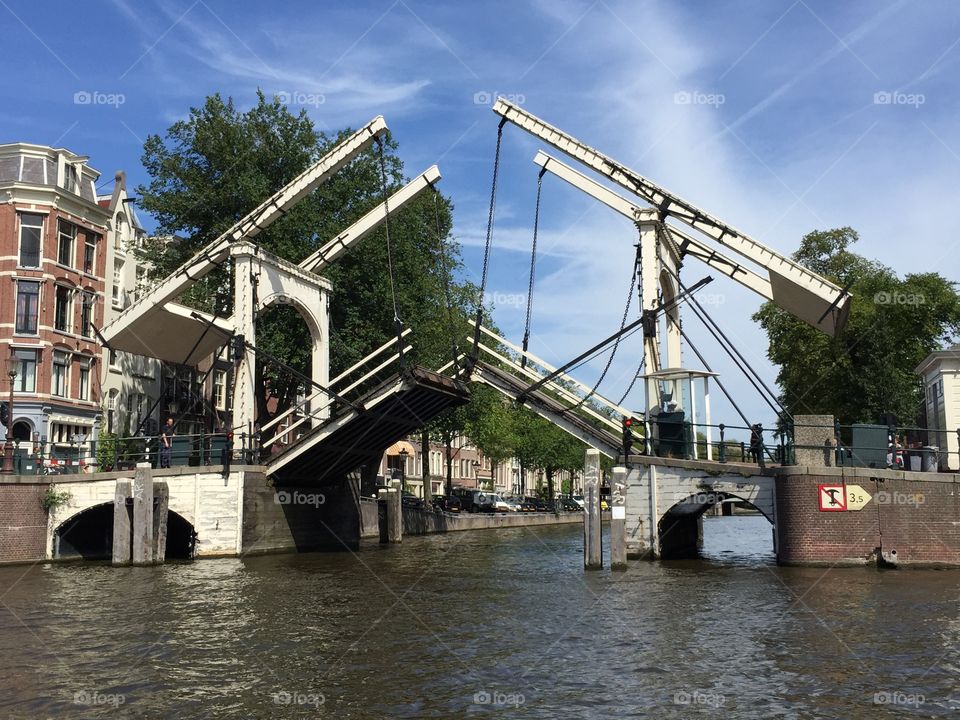 Wooden bridge Amsterdam. Wooden bridge in the amsterdam canals