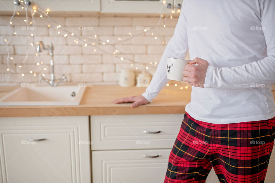 cup of coffee in a cozy festive Christmas atmosphere