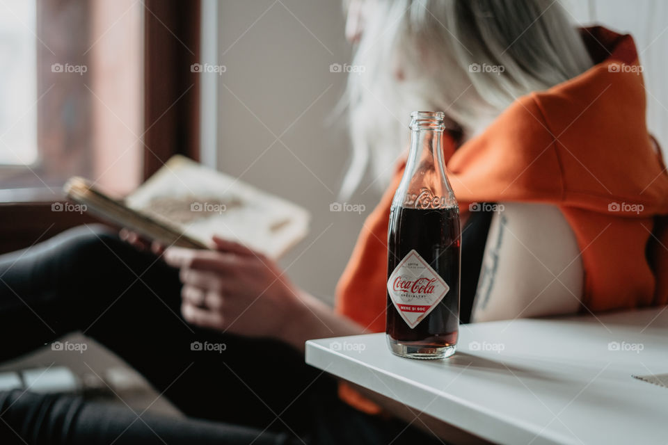 blond girl chilling with coca cola