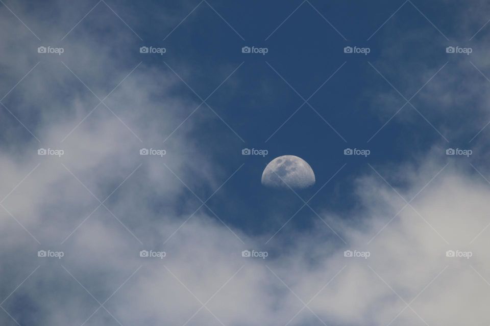 Half Moon Surrounded by Clouds
