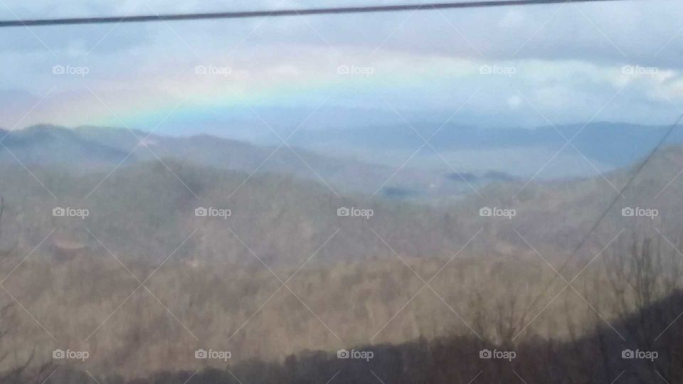 Gorgeous rainbow in the winter Mountains.