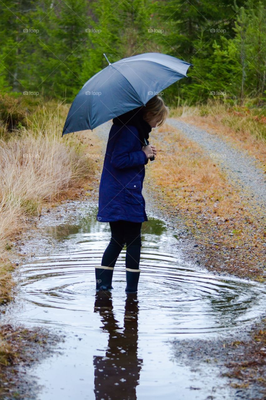 Girl standing on dirt road