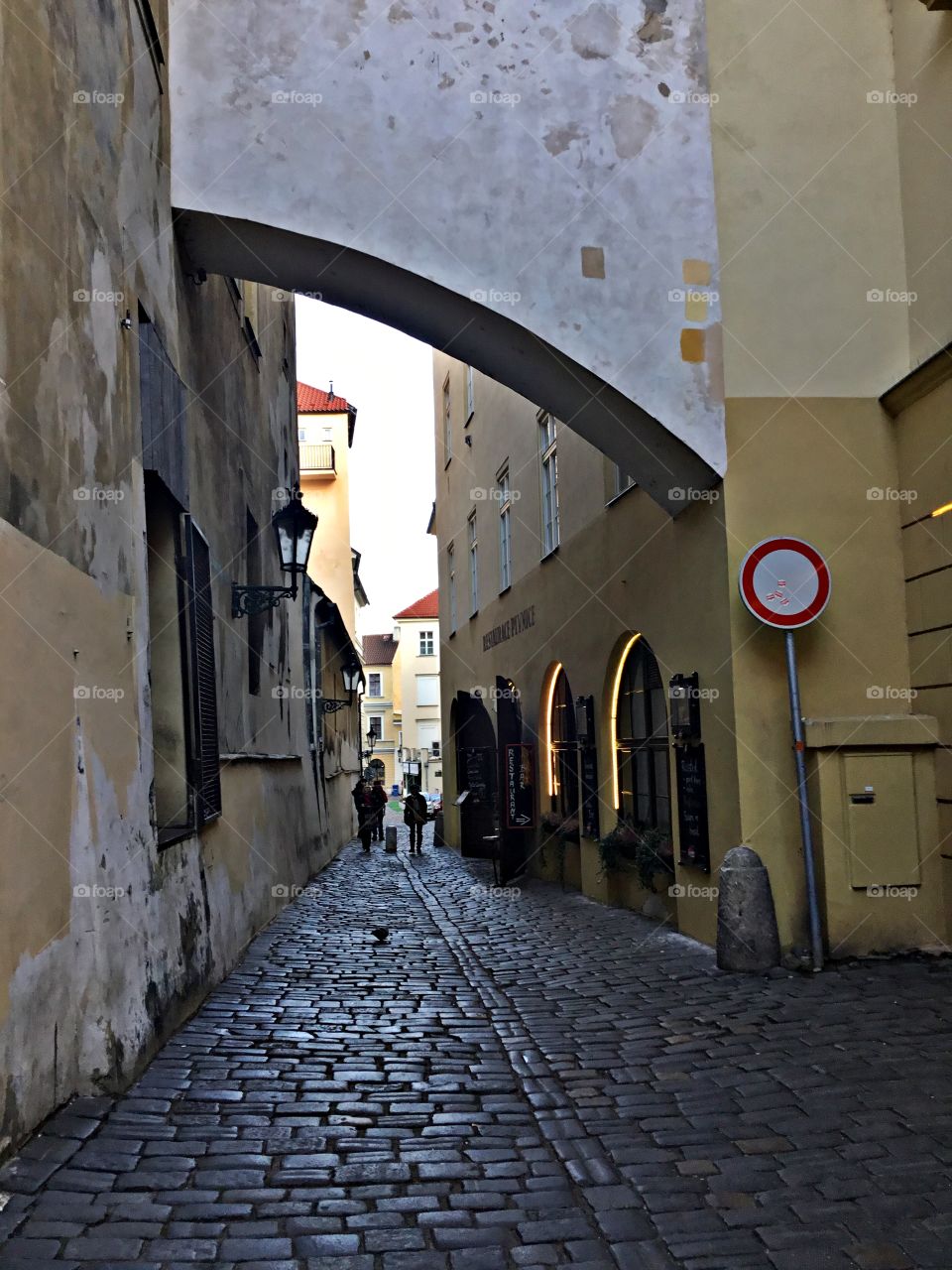 Cities and countrysides - Foap Missions - Cobblestone streets adorn the streets like a jigsaw puzzle through the narrow passage