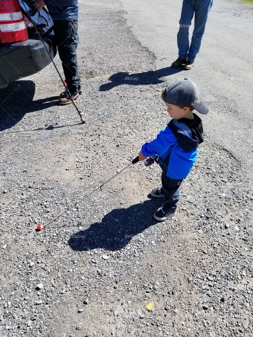 toddler boy south his fishing pole