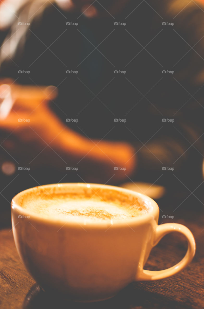 A cup of cappuccino in a cozy café 