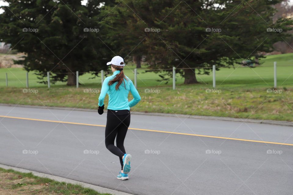 Woman running on the street 