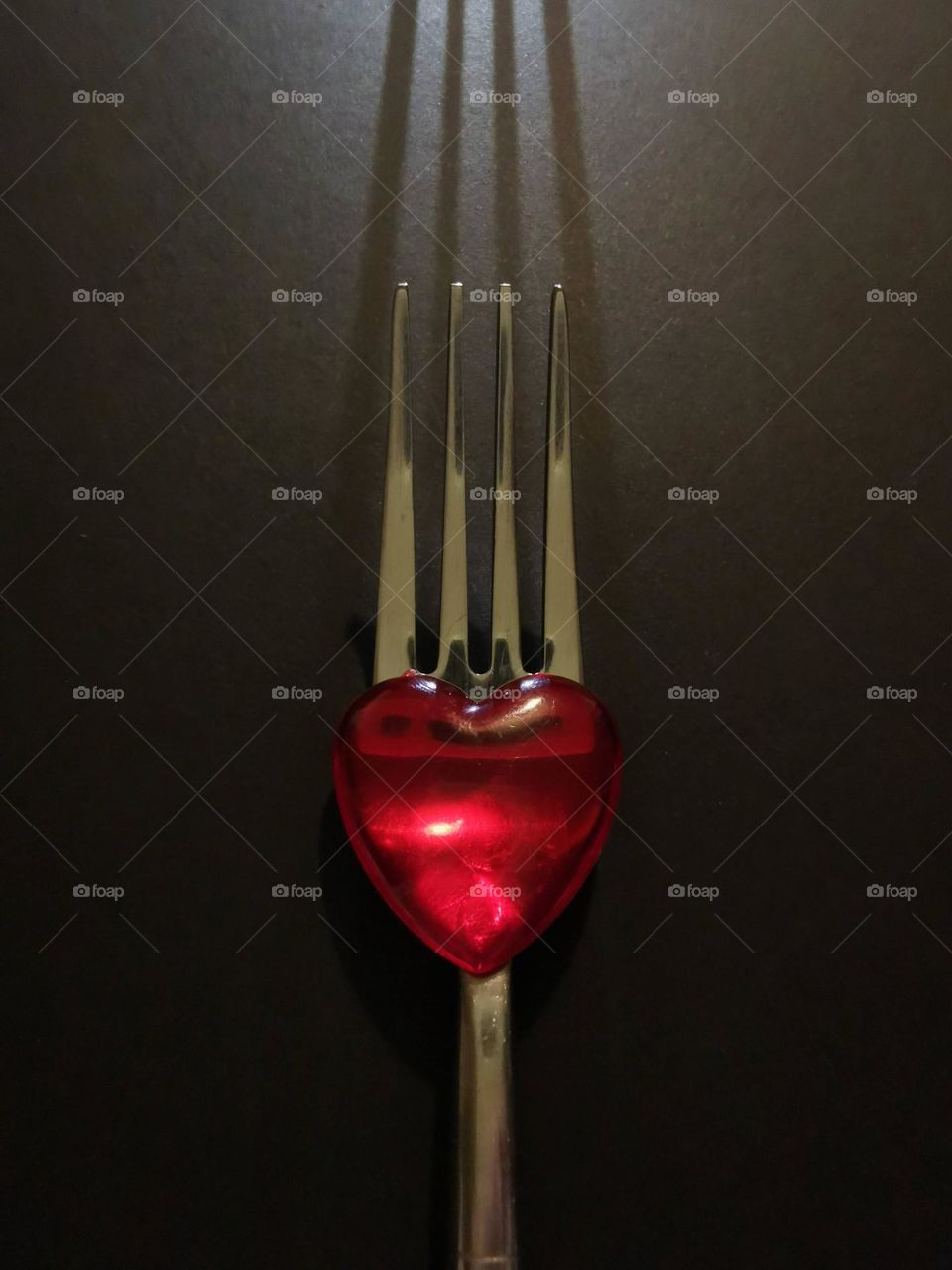 A kitchen fork and red heart. Not ordinary.